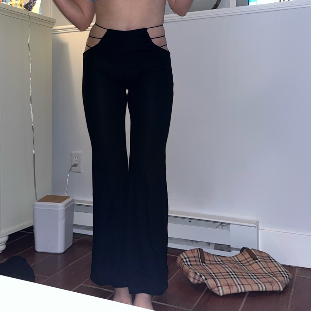 Adika black flare pants with cutout; size small